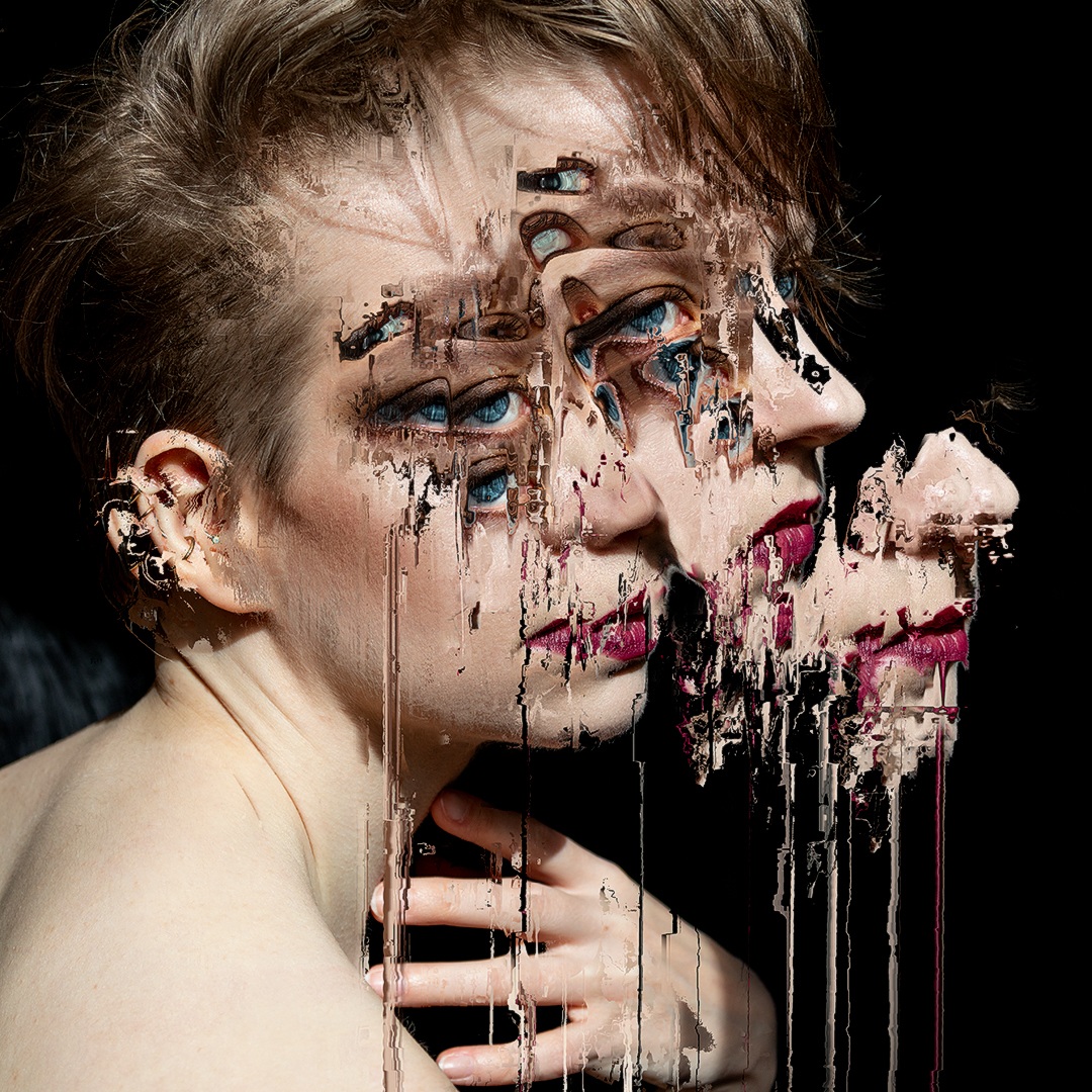 A portrait of a caucasian woman with light brown hair and blue eyes. She is looking to the right and touching her neck slightly with her hand. A deformation of the image doubles the features of her face two times so her nose and lips seems as if extending several times out of themselves, like a stretched harmonica. The texture of the stretch and the distorted features are digital but liquid, and the liquid effect is further accentuated by the distortion on the woman's lips covered in red lipstick that seems to be oozing from one of the stretches. The background is black and the posing of the woman is reminiscent of the poses in classical paining.